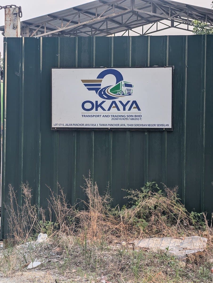 OKAYA Transport and Trading signboard at the Panchor Jaya gate
